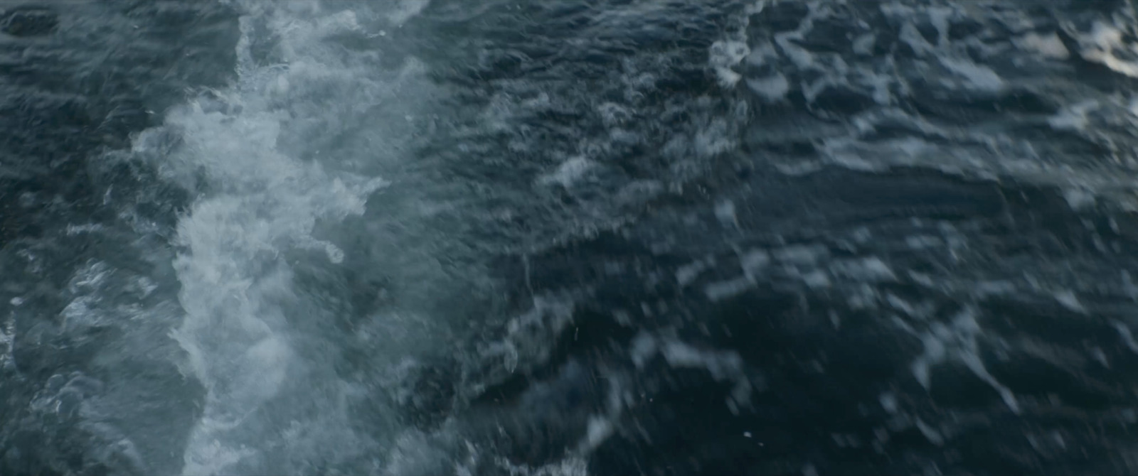 a view of the back of a boat in the water