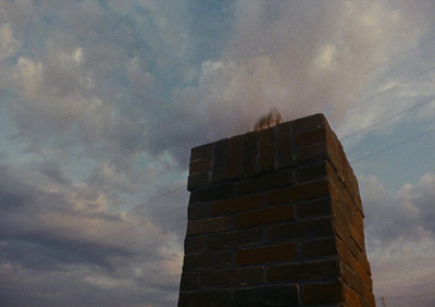 a person standing on top of a brick structure