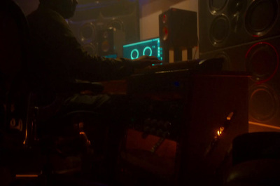 a person sitting at a desk in a dark room