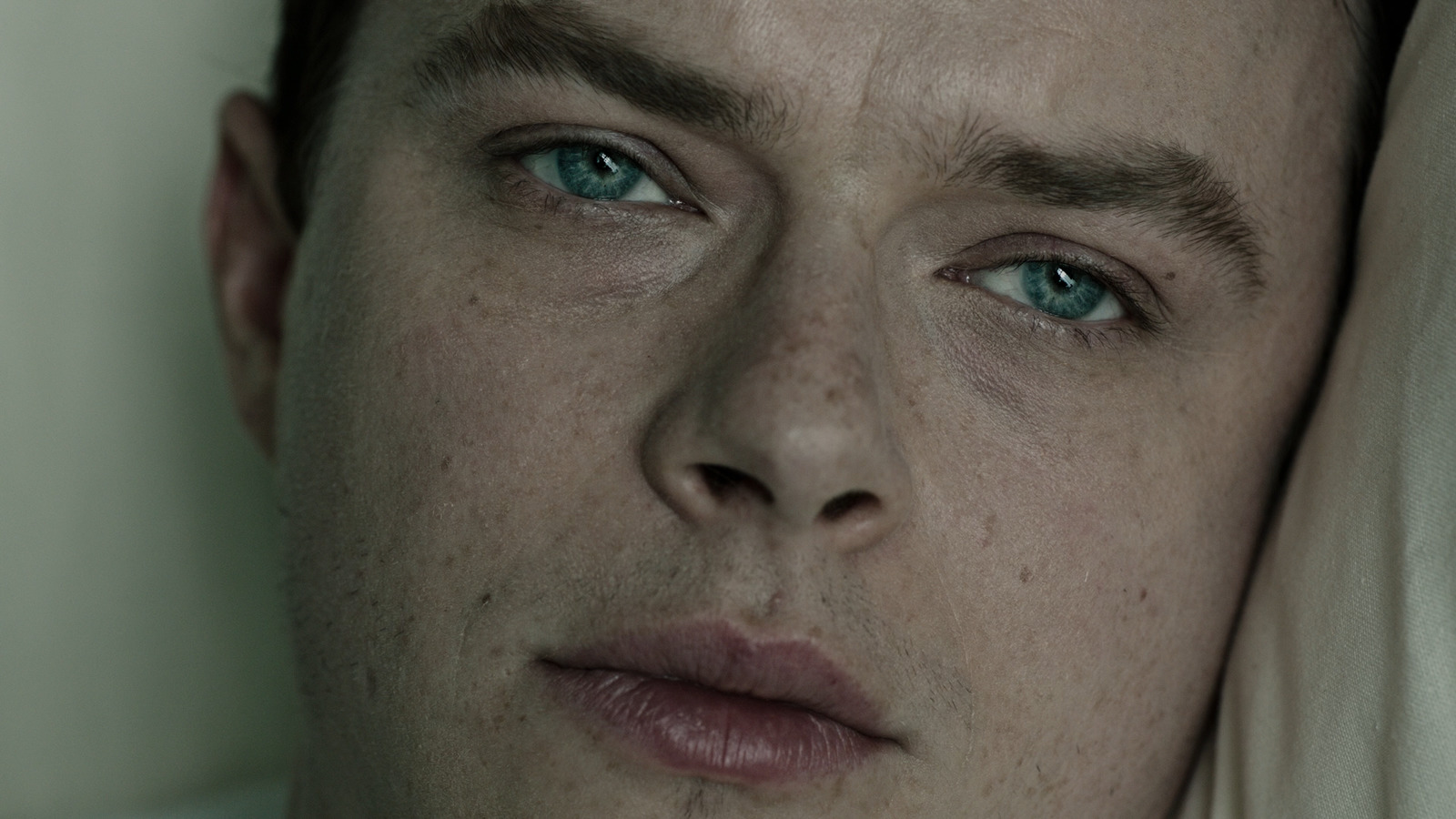 a close up of a person with blue eyes