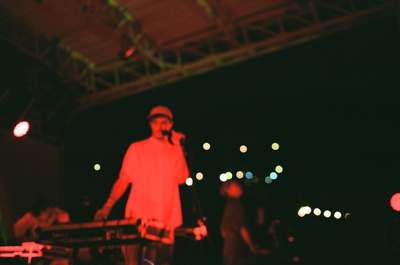 a man standing on a stage in front of a microphone