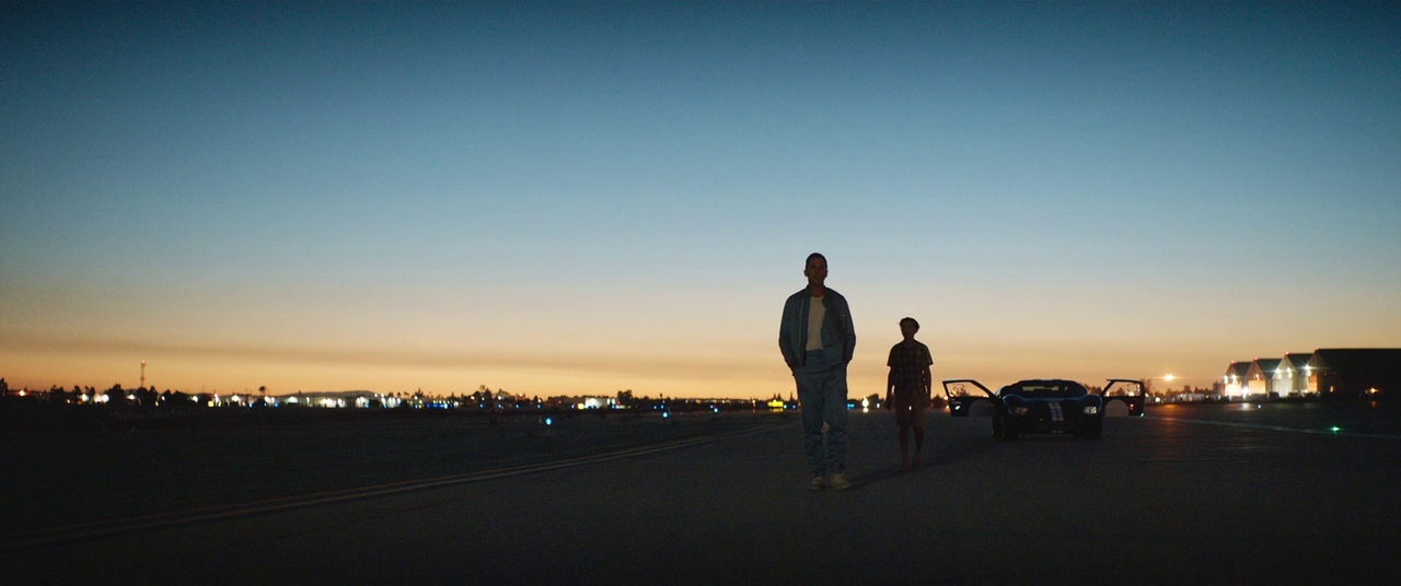 a couple of people that are standing in the street