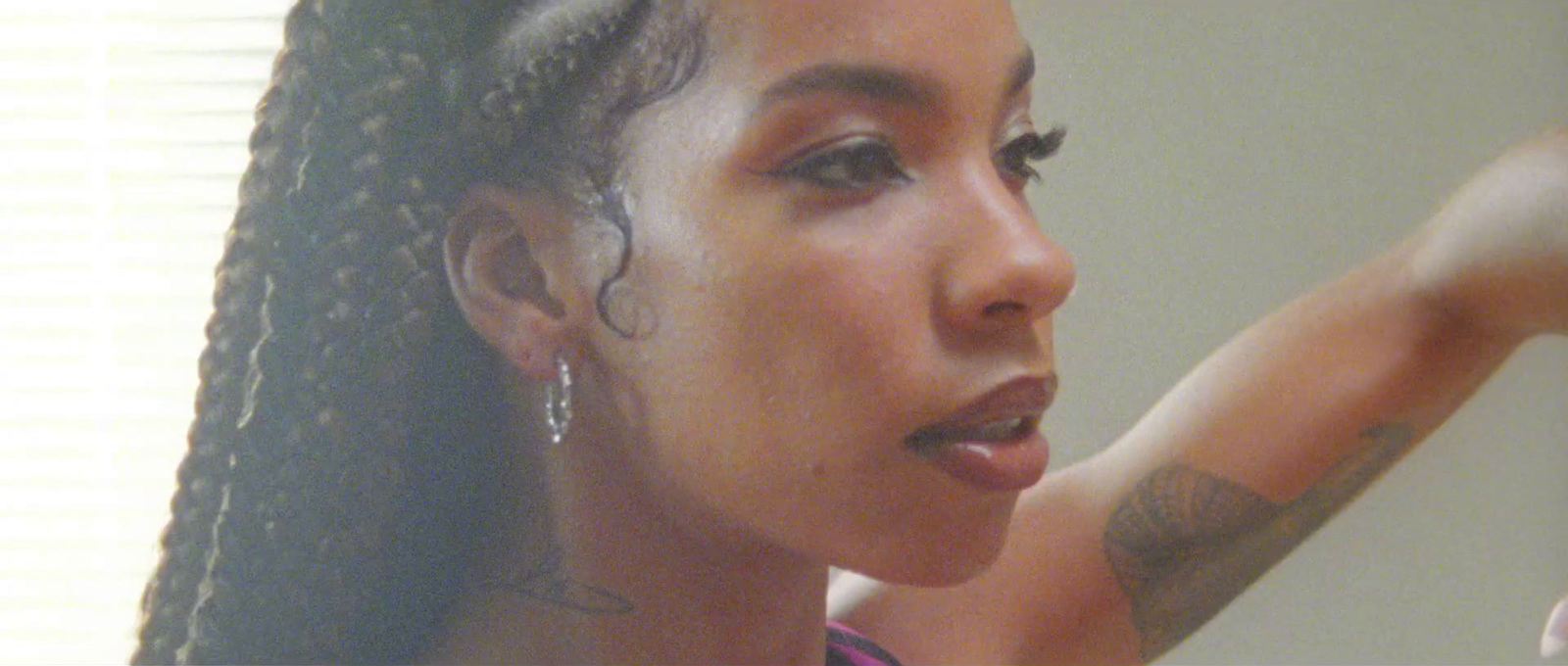 a close up of a person brushing her teeth