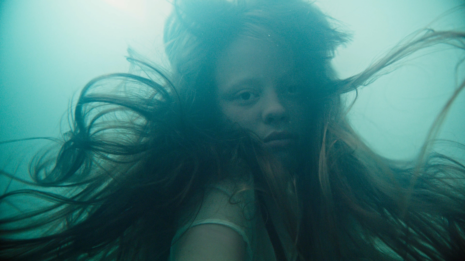 a woman with long hair in the water