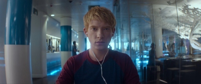 a young man with headphones in a room