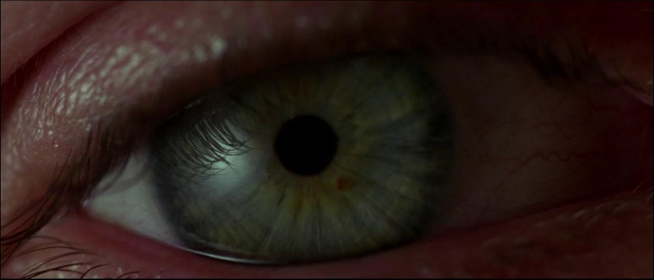 a close up of a person's blue eye