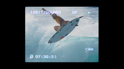 a man riding a wave on top of a surfboard