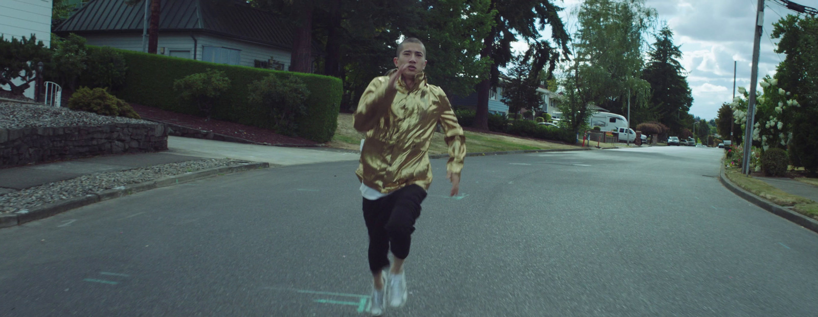 a man running down a street while talking on a cell phone