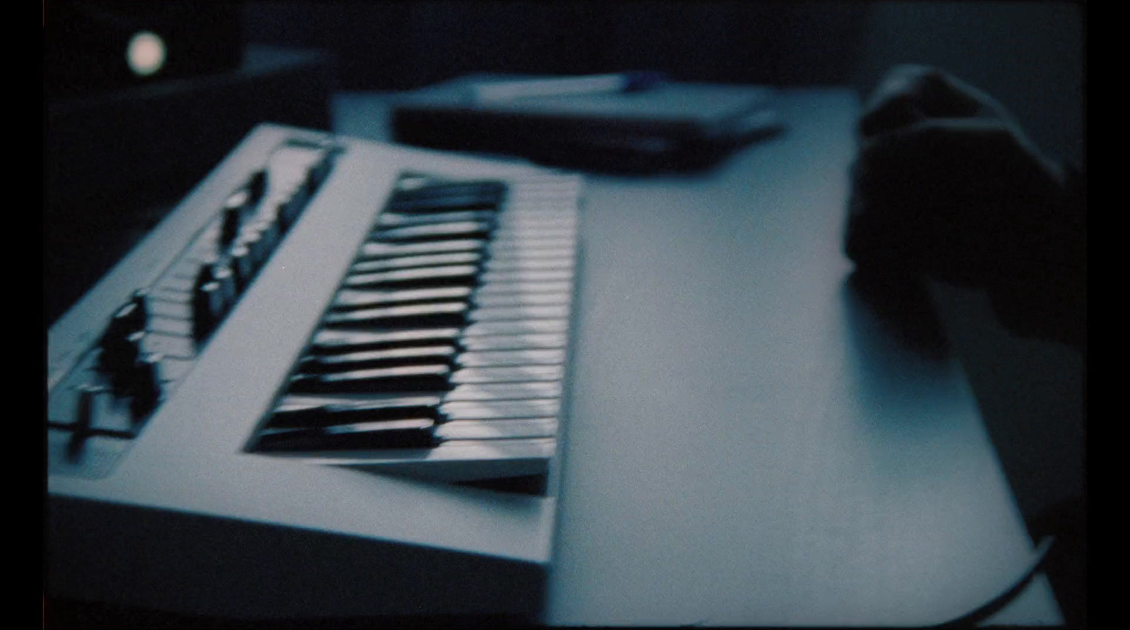 a computer keyboard sitting on top of a desk