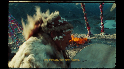 a native american man with feathers on his head