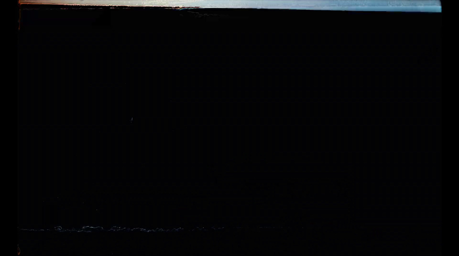 a man riding a surfboard on top of a wave