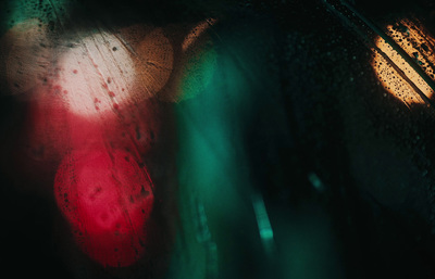 a close up of a traffic light on a rainy day