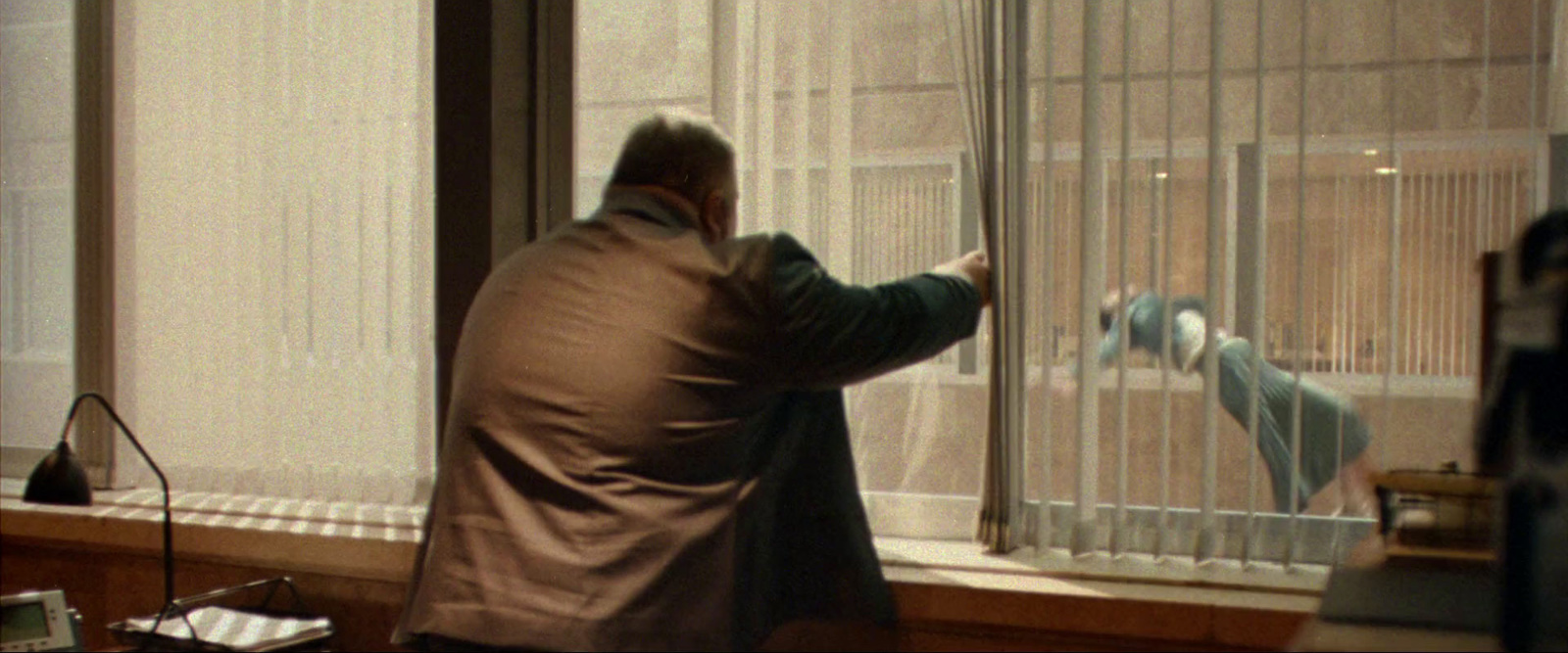 a man standing in front of a window