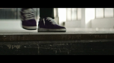 a person standing on a step with their shoes on