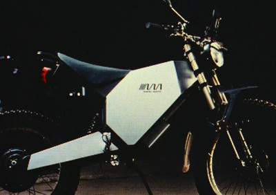 a white and black motorcycle parked in a parking lot