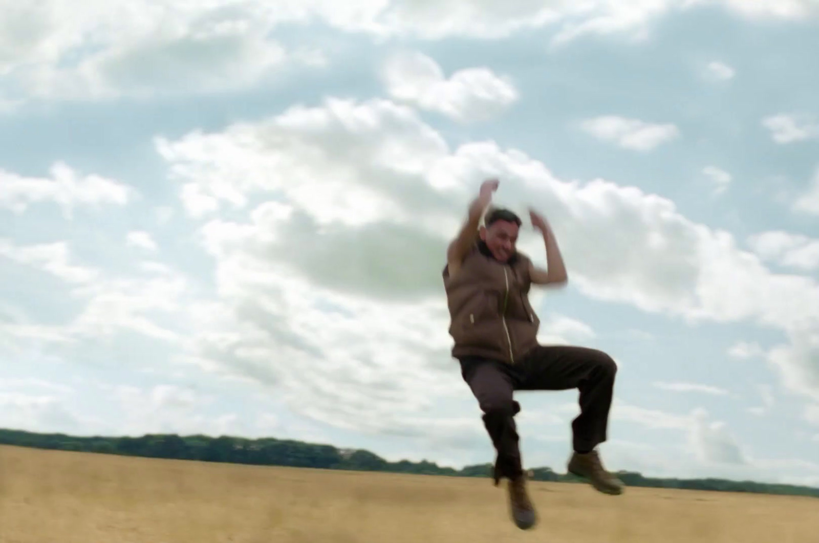 a man jumping in the air with a frisbee in his hand