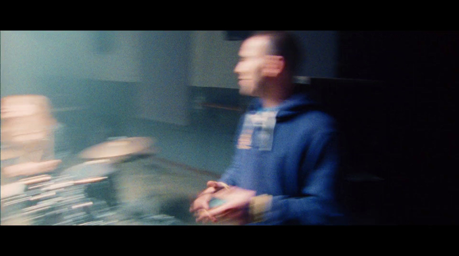 a blurry image of a man standing in a room