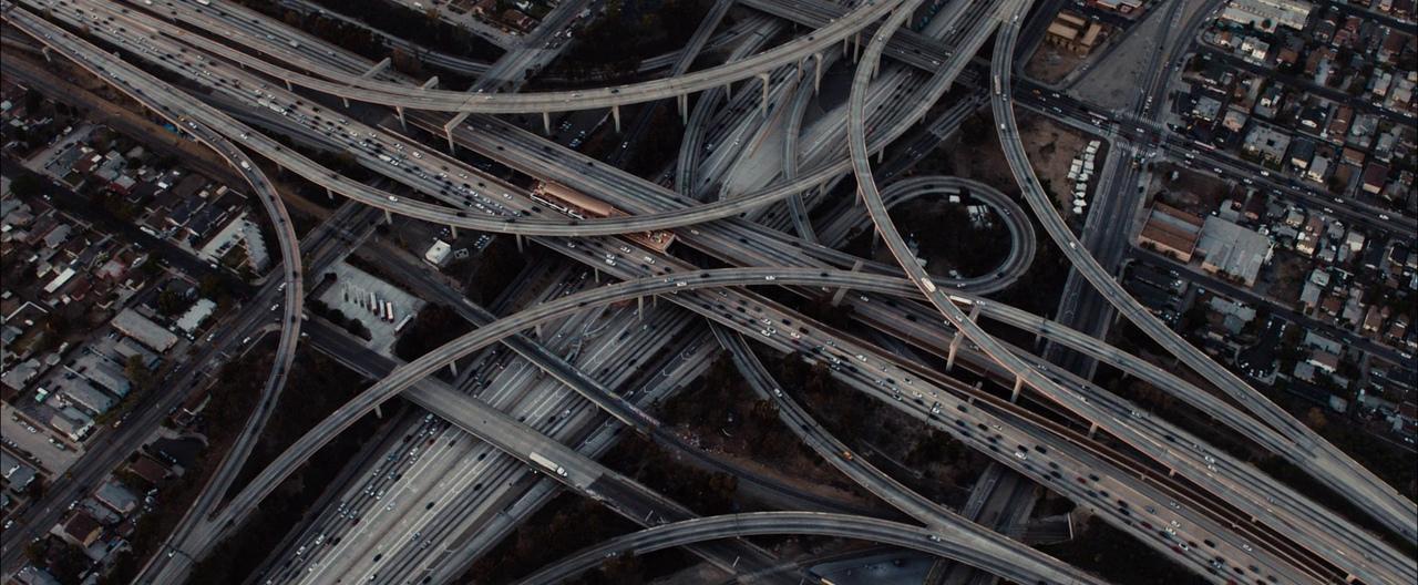 an aerial view of a highway intersection with multiple lanes