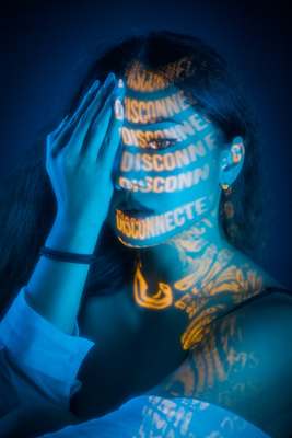 a woman with her face painted with words