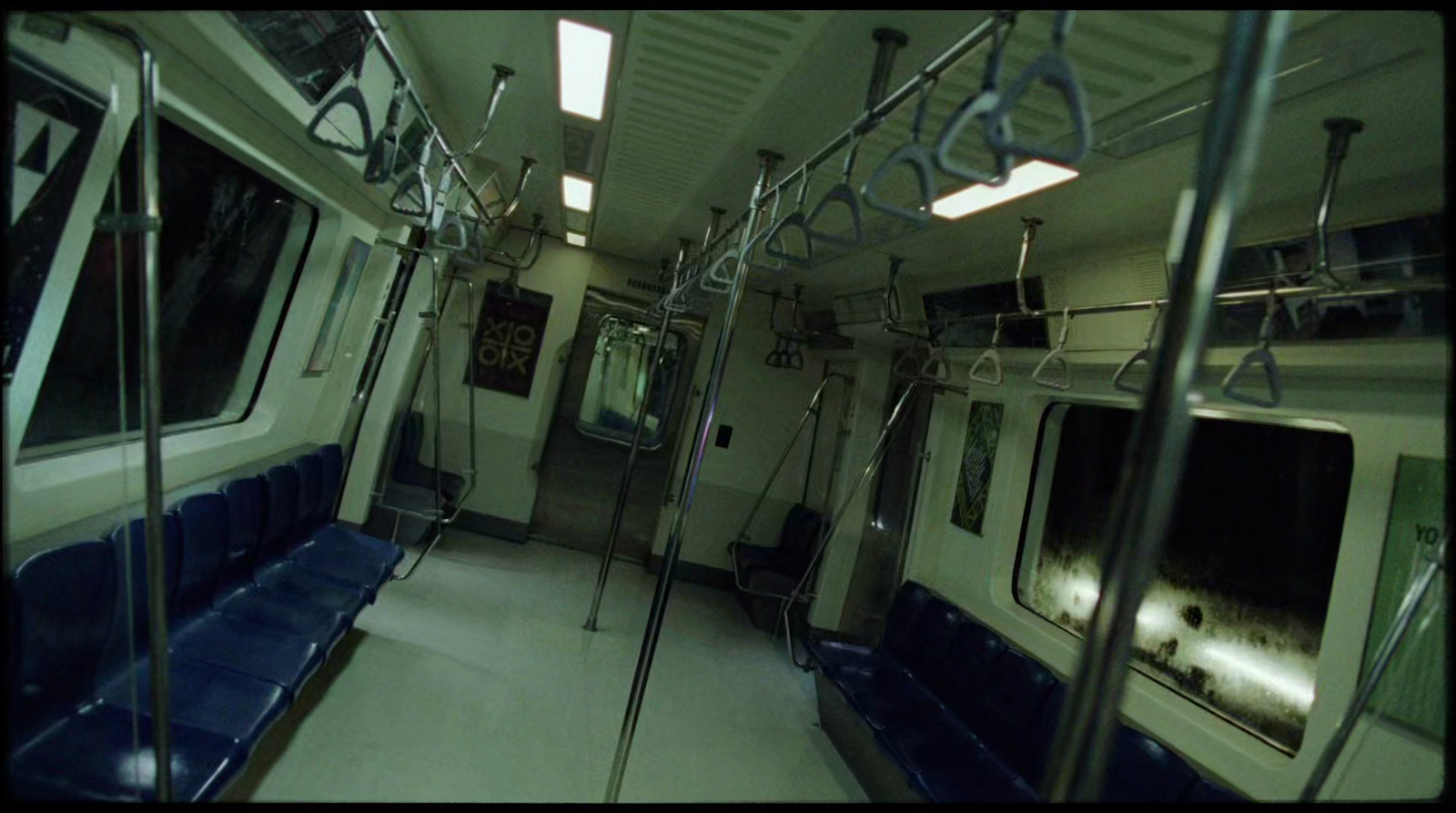 a view of a subway car with blue seats