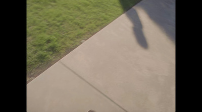 a man riding a skateboard down a cement ramp