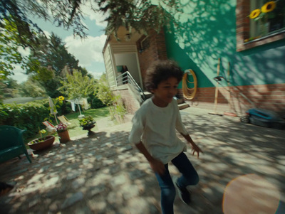 a young boy is playing with a frisbee