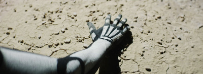 a person's hand with a black and white design on it