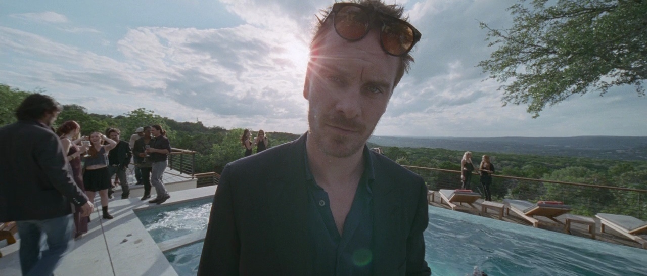 a man standing in front of a swimming pool