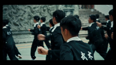 a group of young men dressed in black and white