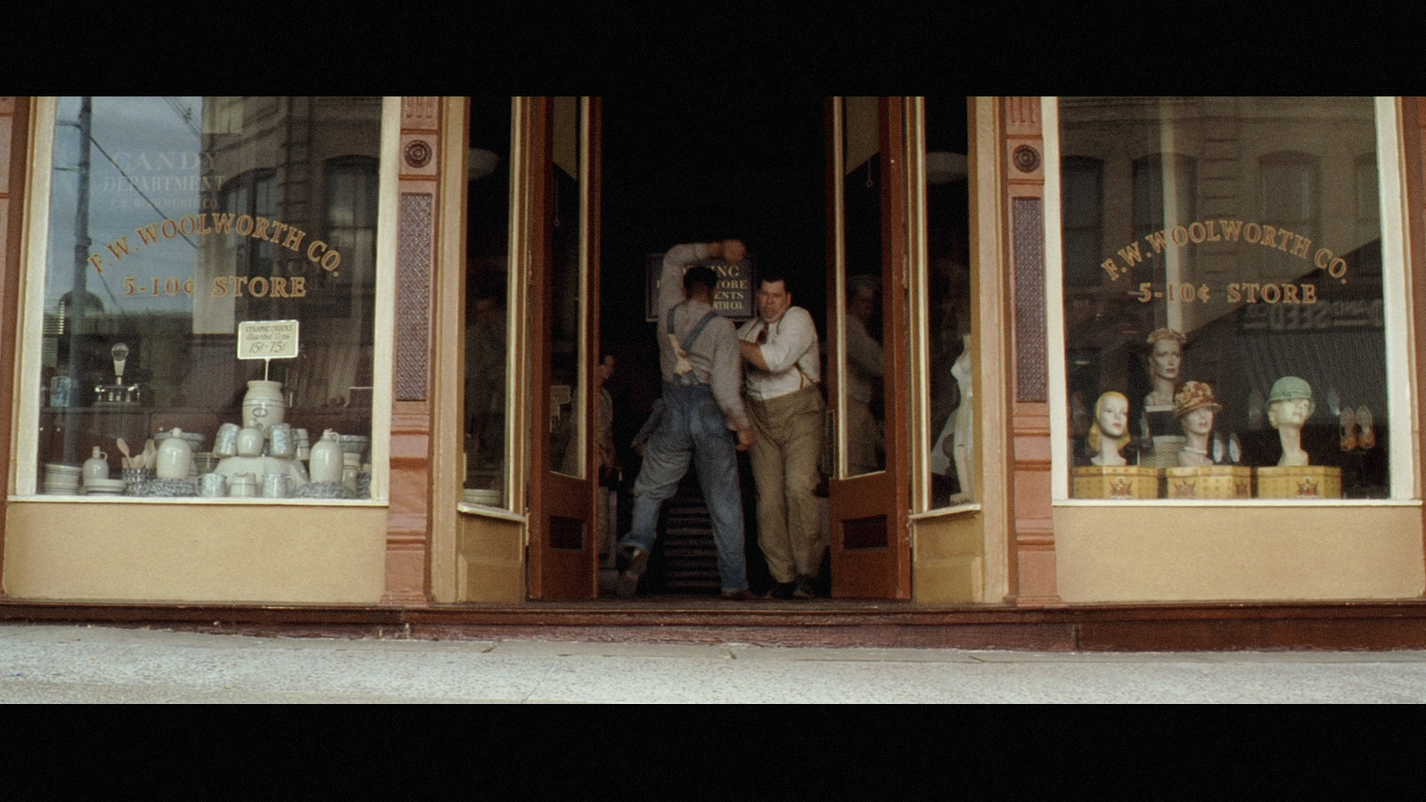 a couple of people that are standing in a doorway