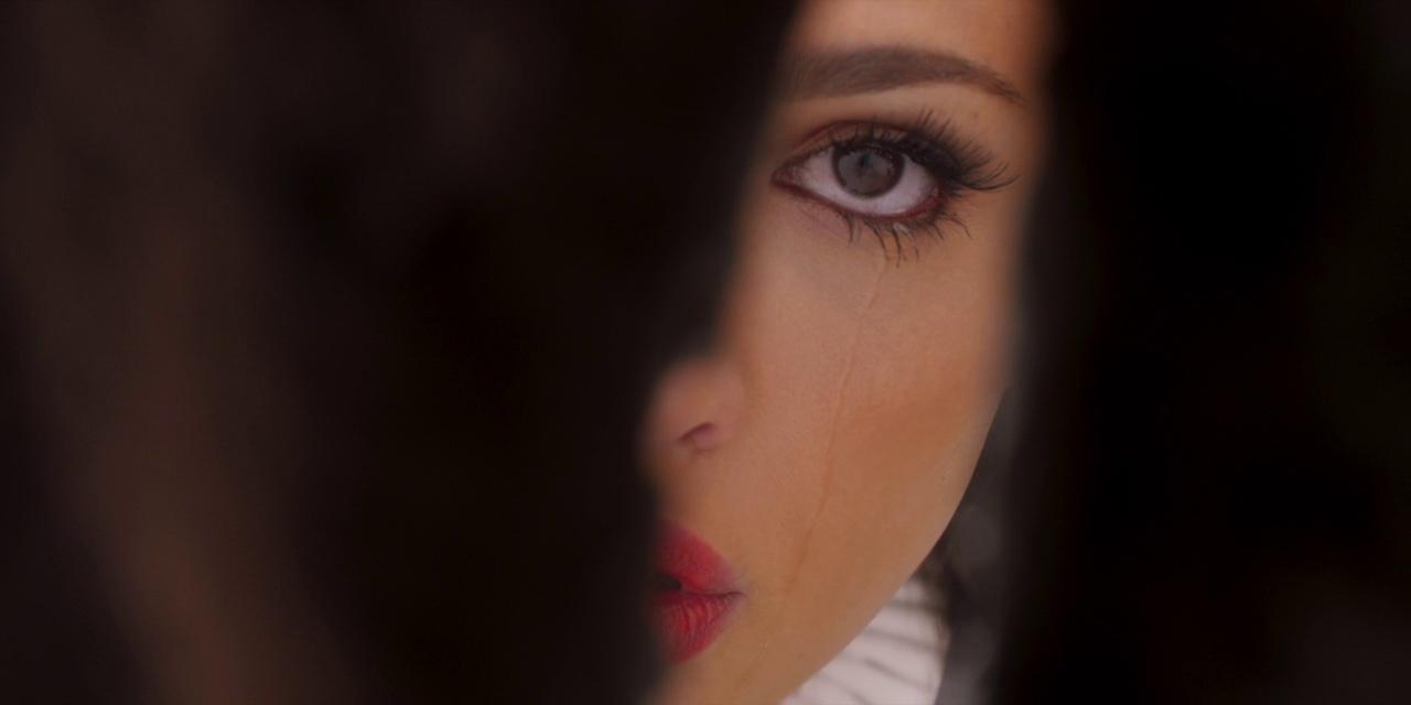 a close up of a woman's face with a red lipstick