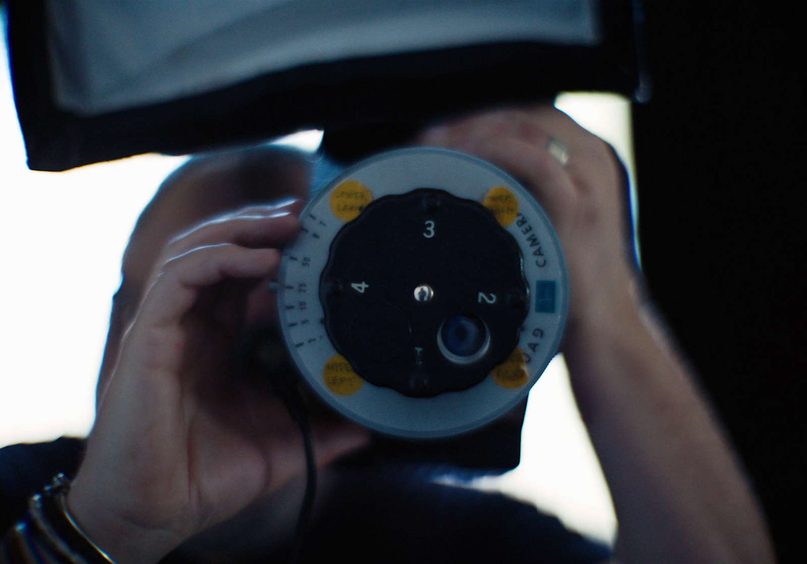 a close up of a person holding a device