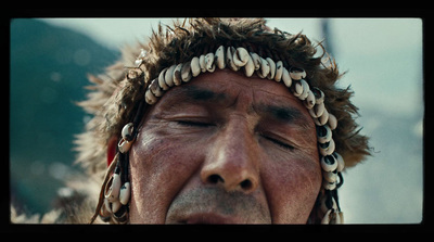 a close up of a person wearing a headdress