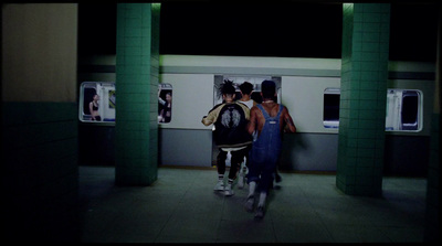 a group of people standing on a subway platform