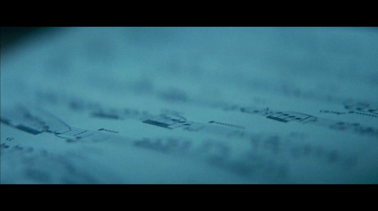 a close up of a snow covered ground with a sky background