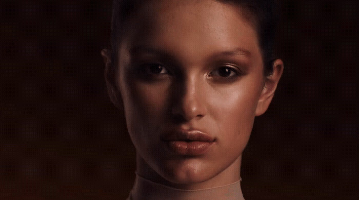 a close up of a woman wearing a neck tie