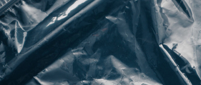 a close up of a plastic bag filled with toothbrushes