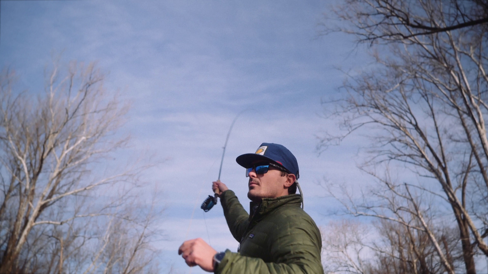 a man is flying a kite in the air