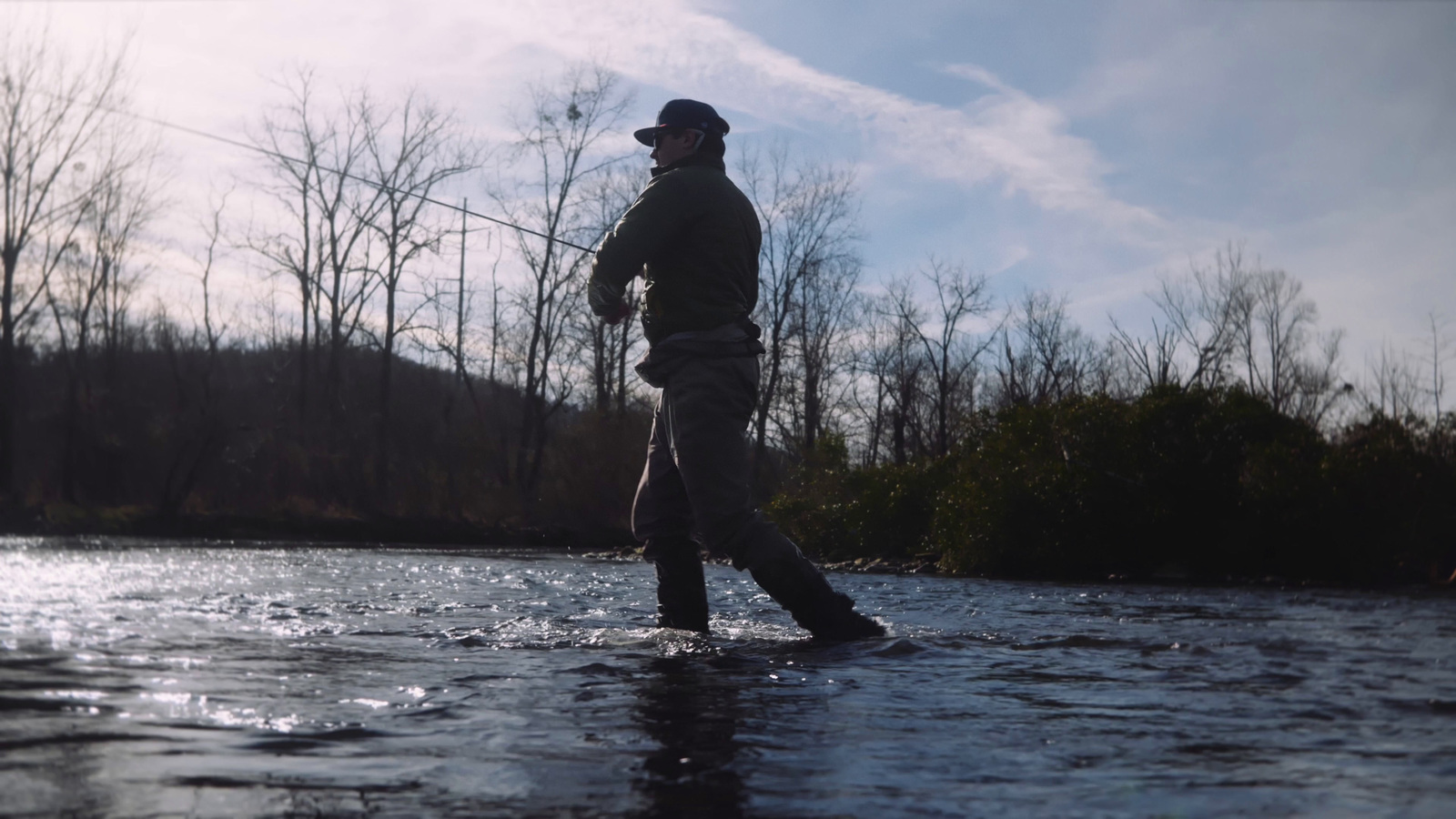 a man standing in the middle of a river