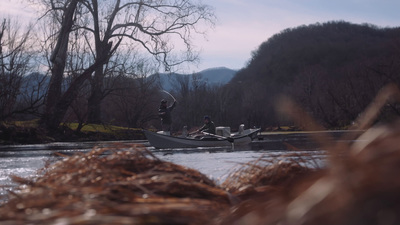 a couple of people on a boat in the water