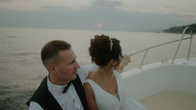 a man and a woman on a boat in the water