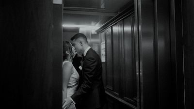 a man and a woman standing in a hallway