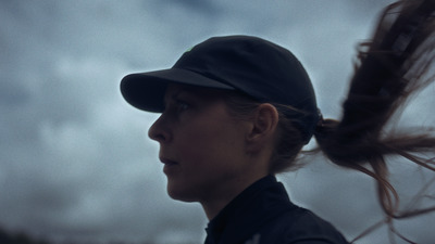 a woman with a ponytail in a baseball cap