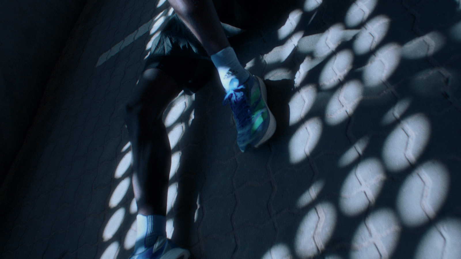 a person laying on the ground with their feet on a skateboard