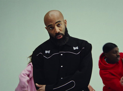 a man in a black shirt and a woman in a red jacket