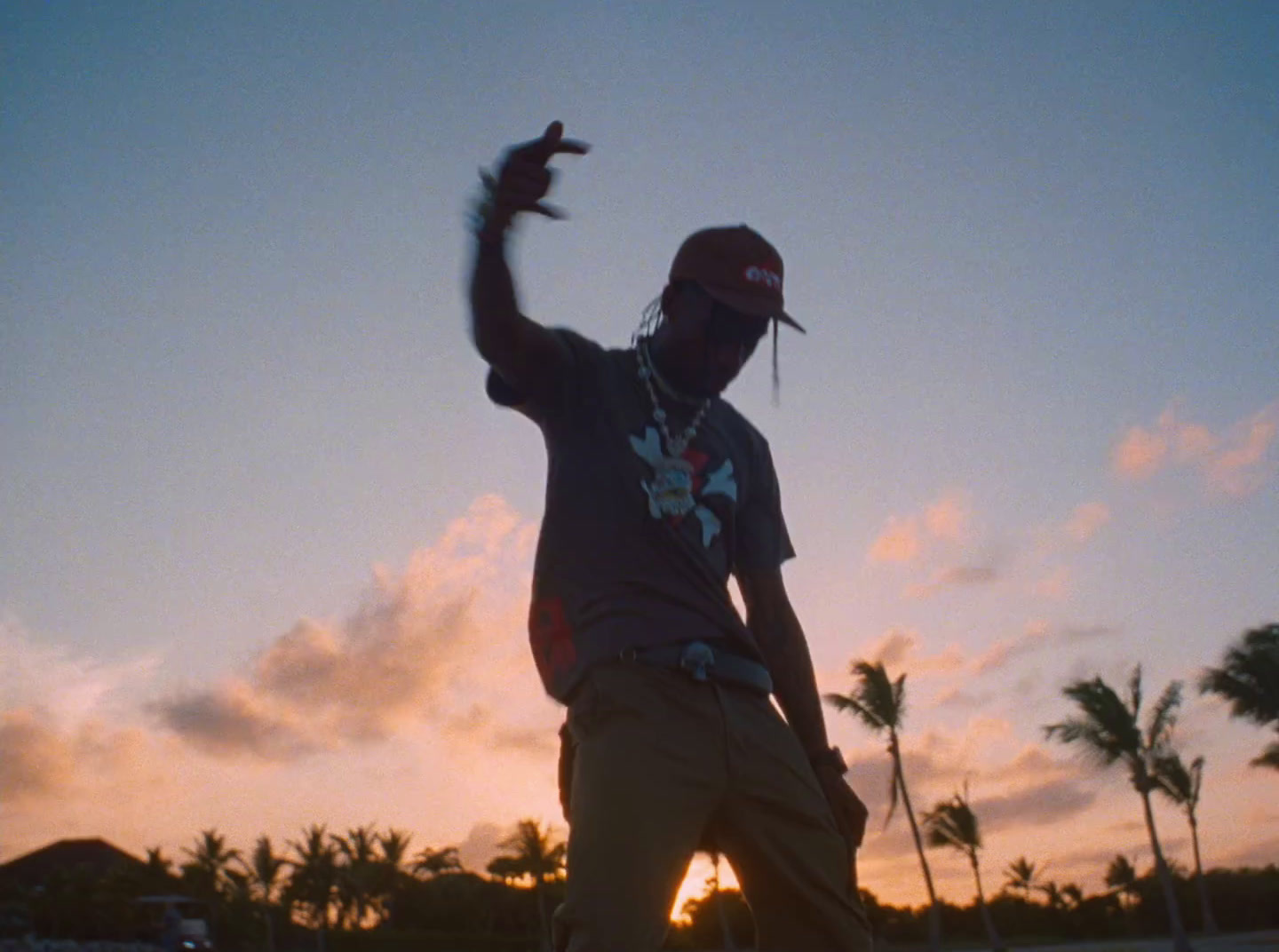 a man riding a skateboard on top of a sandy beach