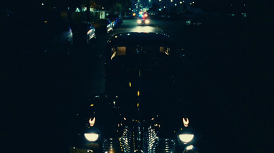 a train traveling down train tracks at night