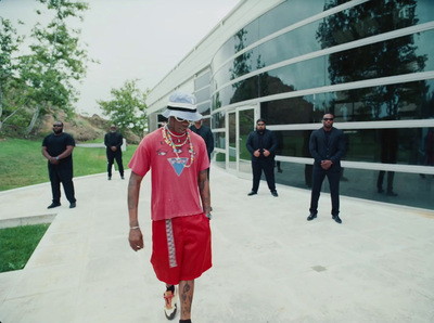 a group of men standing in front of a building