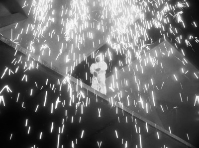 a black and white photo of fireworks