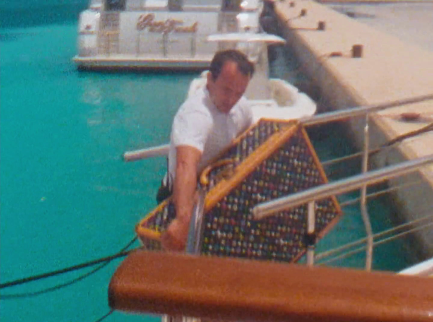 a man standing on the deck of a boat